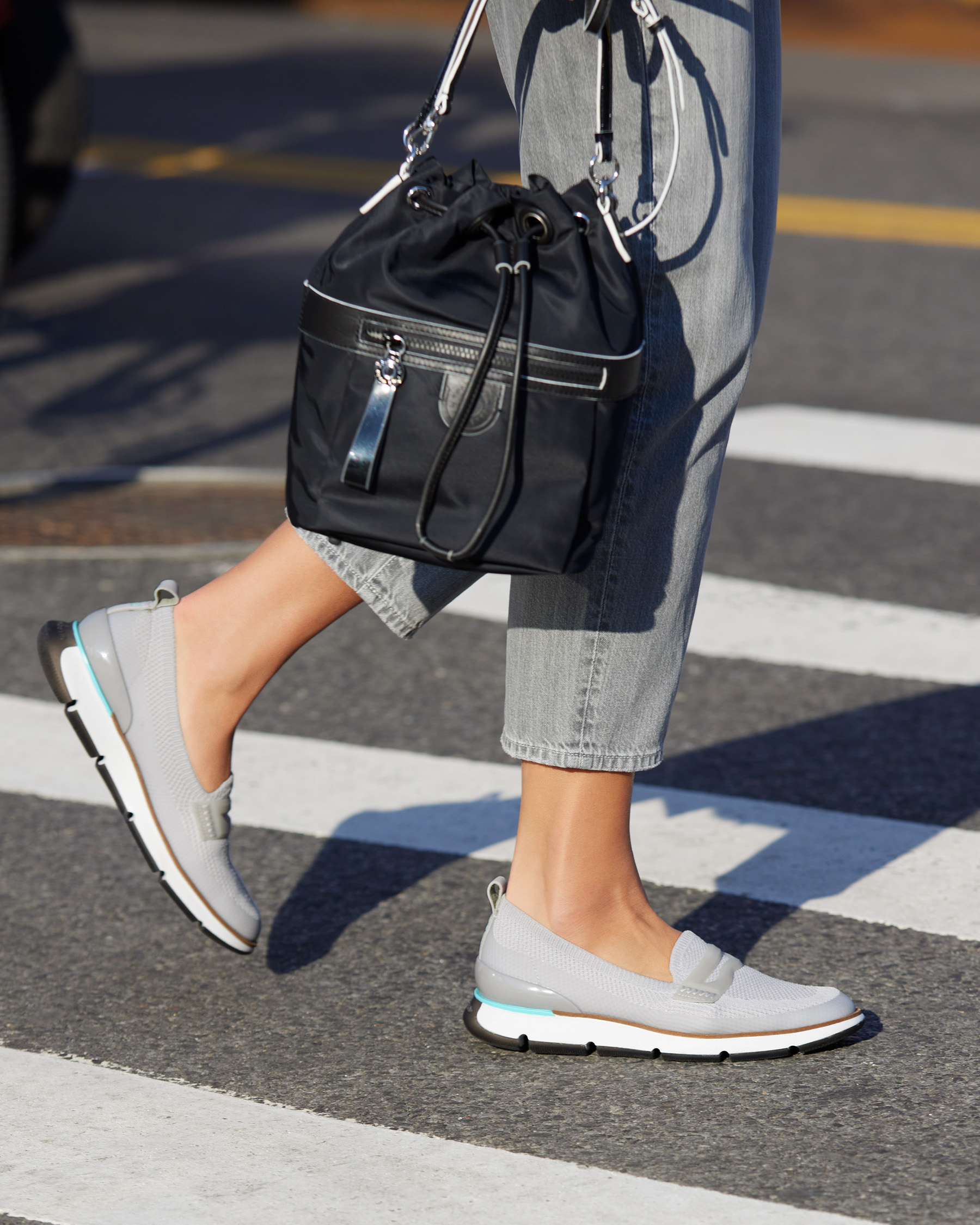 Cole Haan on X Crossbody on a crosswalk Our new Nylon Drawstring Crossbody Bag carries what you need for the day while our new 4.ZEROGRAND loafers take you there. Shop Women s New