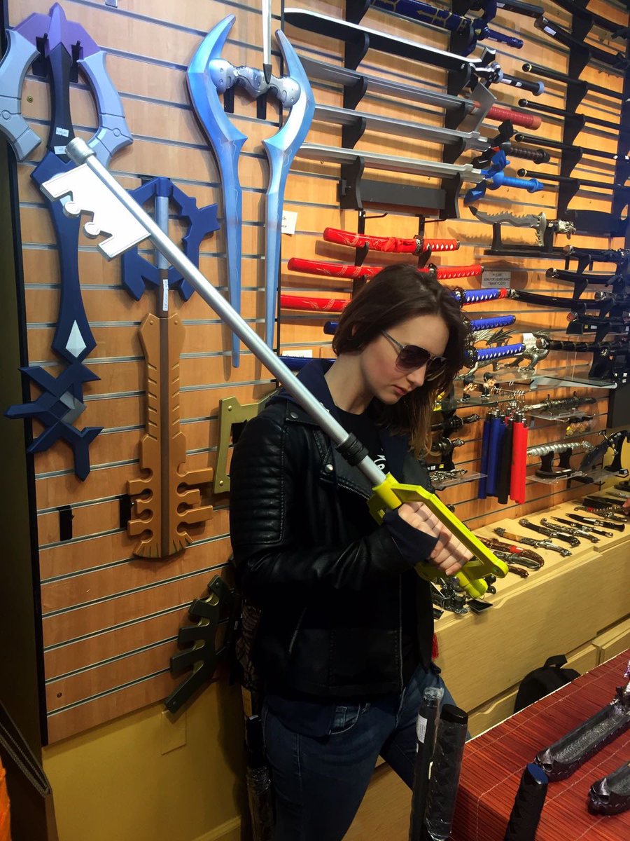 Girl in leather jacket holding a keyblade from kingdom hearts hearts