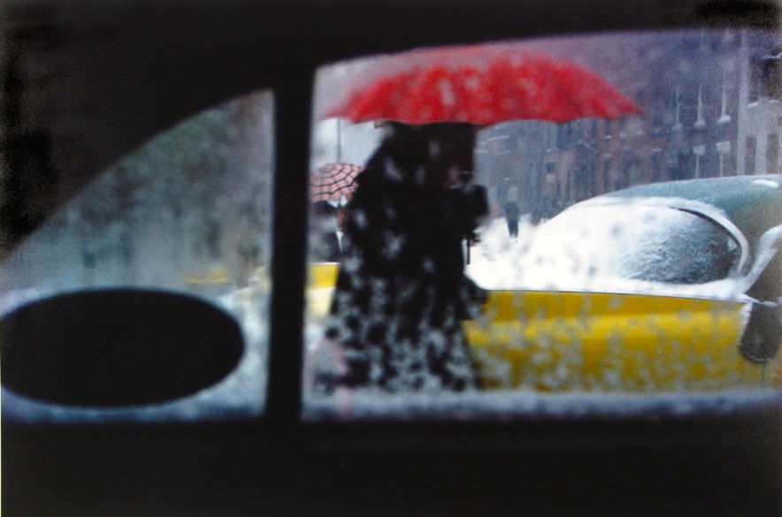 Red Umbrella, 1960 by Saul Leiter. In an age dominated by monochrome photography he captured the world as a soothing polychromatic symphony.