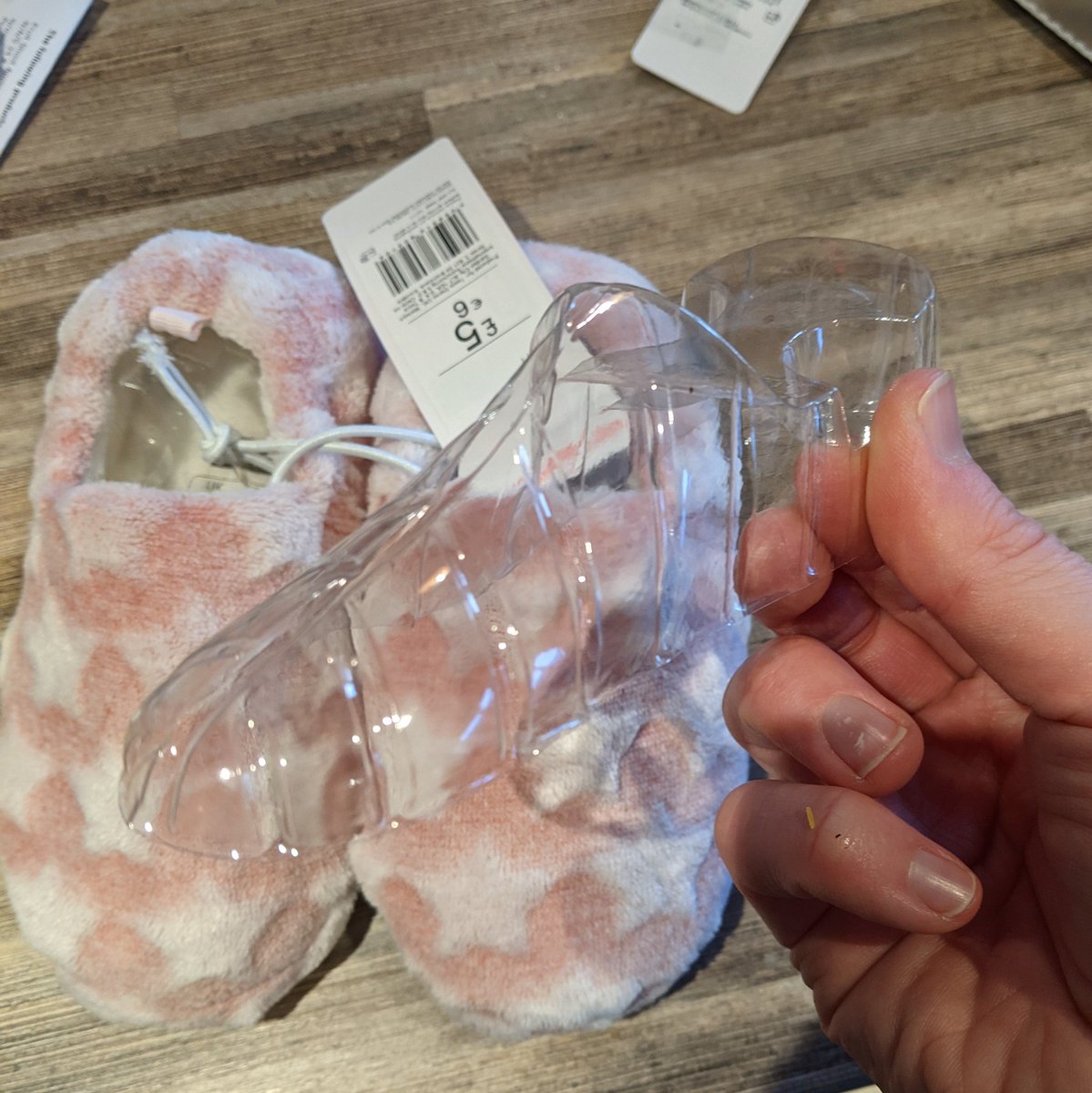 PaulAden's tweet photo. Hey @Tesco what's the deal with this plastic insert in a pair of kids slippers? Seems very wasteful. I'd much rather have slightly squashed slippers than a dead planet. #thinkoftheanimals #plasticfree #oneworld https://t.co/oboZ3C318Q