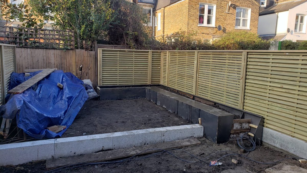 Tough week but good progress installing new fence and steel box flower beds at our Balham site