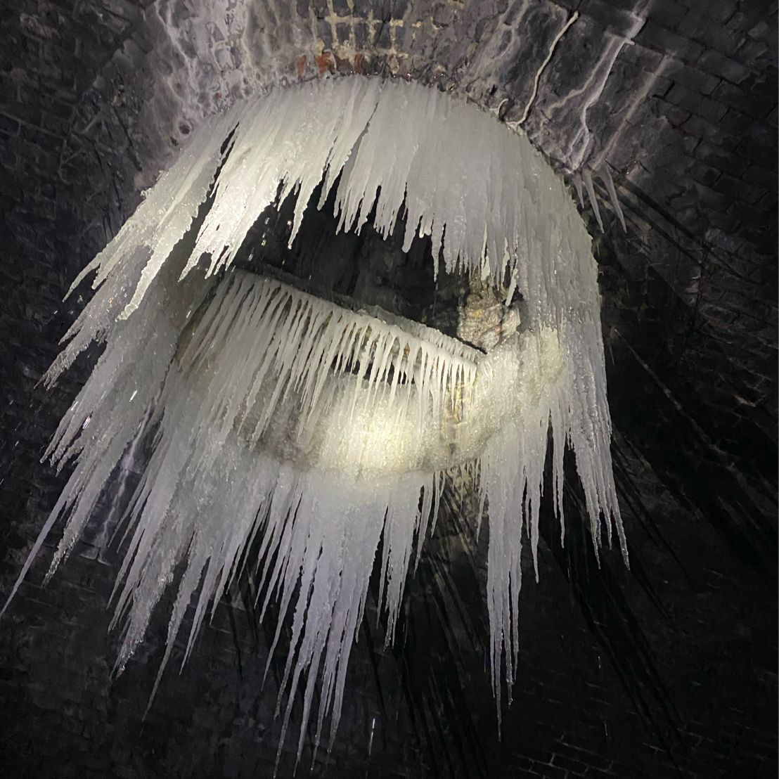 Icicles forming a circle around a smoke duct on the roof of Moncrieff tunnel in Perth