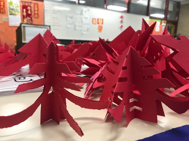 SaintPatrickHS's tweet photo. In Ms. Lai’s Chinese class, students made 3D Chinese New Year Spring Trees. The trees represent the Chinese New Year & the color red brings good luck and prosperity to the environment. Happy Year of the Ox! Xin nian kuai le! #ShamrocksHybridLearning https://t.co/YTC9tbTncI