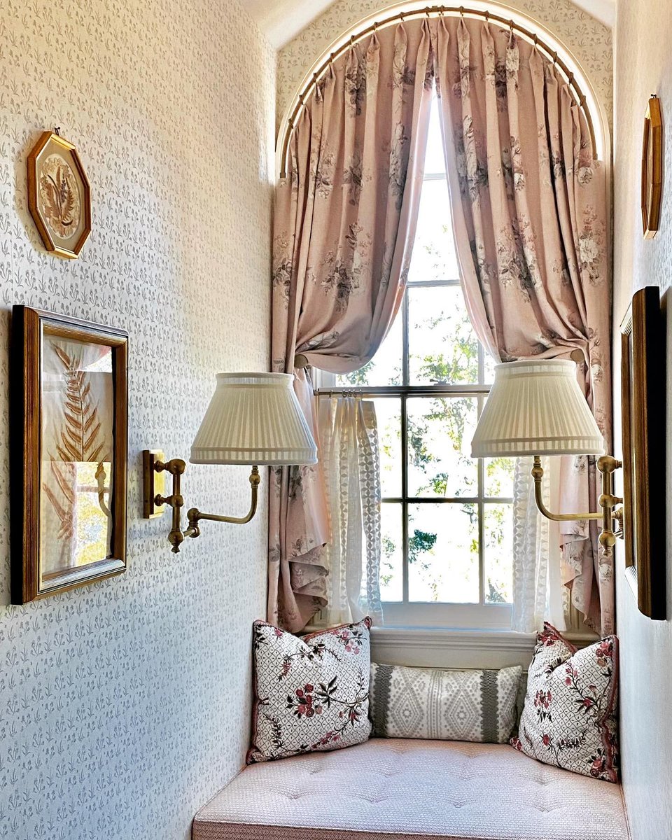 Winding down the week, wishing we were nestled inside this charming dormer—design by Chuck Chewning (bit.ly/3jVjW5X). Trimming pillows, the Mariachi Braid by @laurakirar for S&amp;S. #samuelandsons