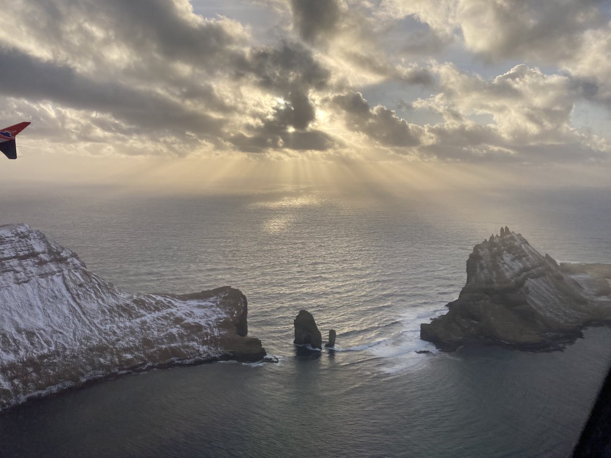 Beautiful view from the plane home to the Faroe Islands today.

The picture shows Tindhólmur and Drangarnir west of the island of Vágar.