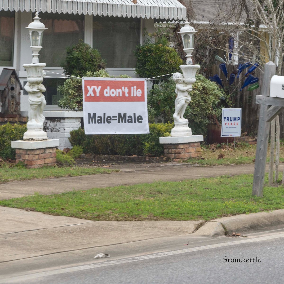 Milton, Florida. Hick, backwater (literally), Southern town. This guy is mad about trans people. Last week the sign said "Biden Stole It!" But this week, it's trans folk. And he's mad enough to put up this sign in his front yard. 1/