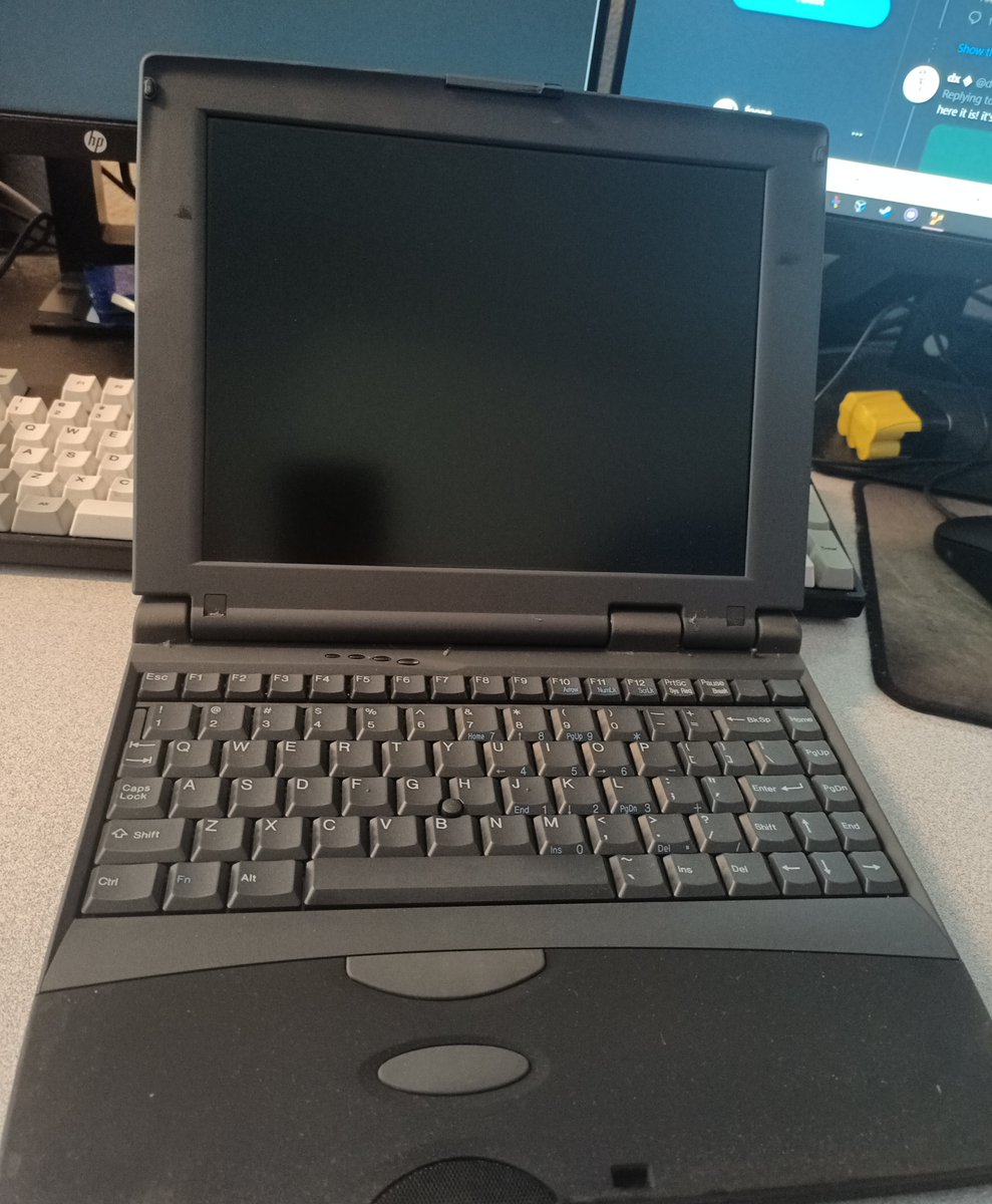 Want to see an incredibly boring looking laptop that's a lot more interesting than it looks? So here's a very generic dark grey laptop. It's got a Thinkpad-style MouseClit™, but it looks really generic.