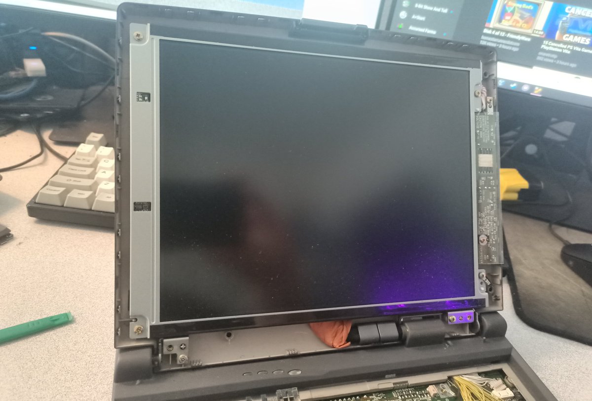 Gotta open up the LCD panel to get the rest of the top plastic piece off