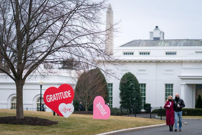 President Biden and First Lady Jill Biden walk outside the White House