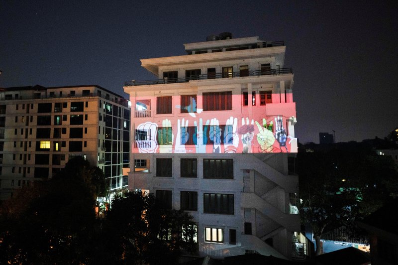 Myanmar artists are adding their creativity to the broad popular opposition to the military's coup--here, three-finger salutes projected onto a building. time.com/5938674/myanma…