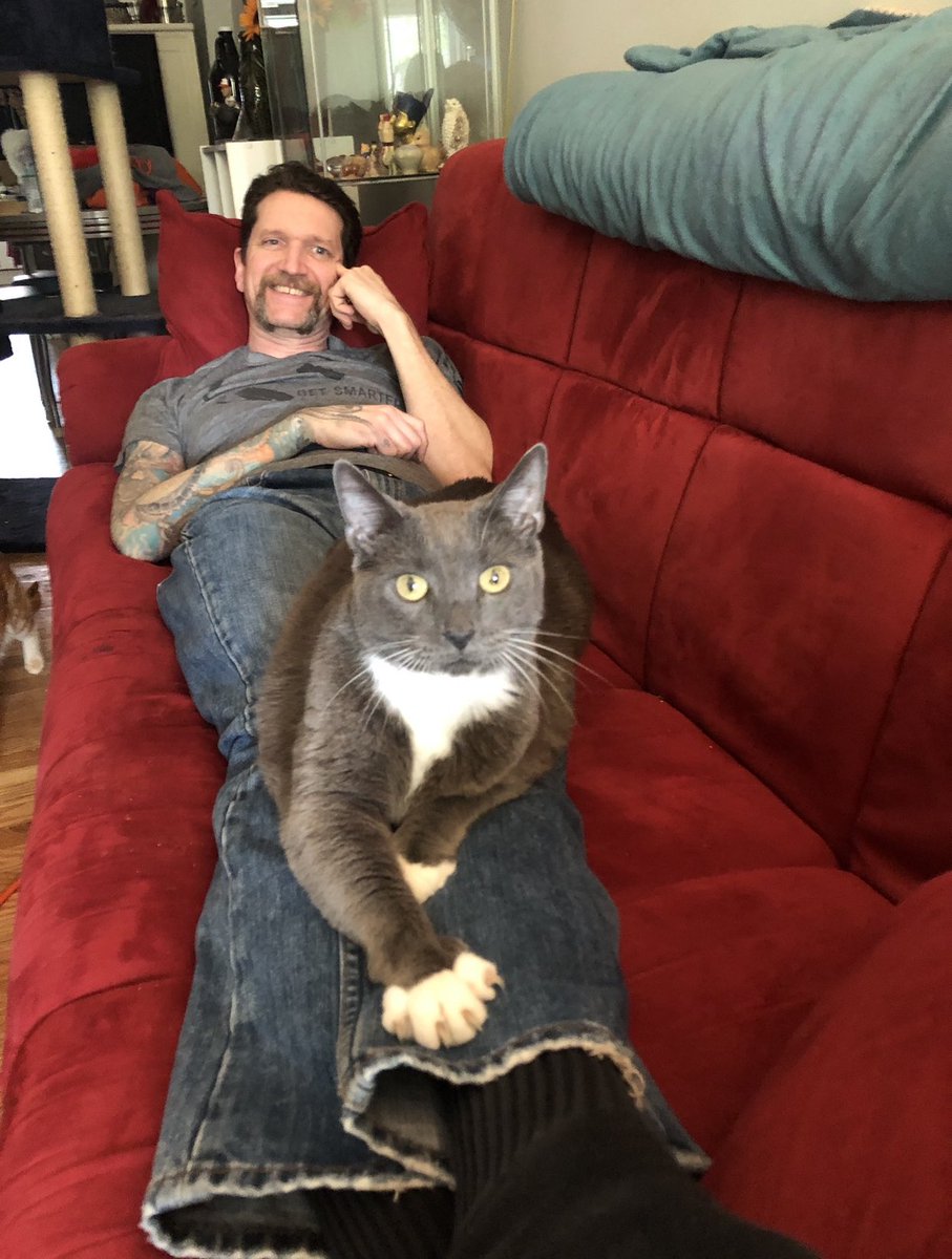 Okay here is my husborz with three of our kittorz.