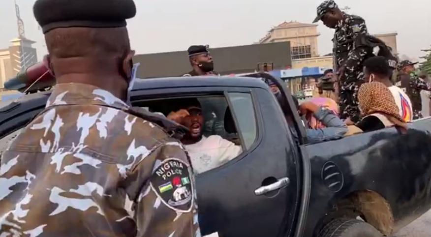 MobilePunch's tweet photo. PHOTOS: Police arrest protesters at Lekki Tollgate https://t.co/iD1ZoPhDEh