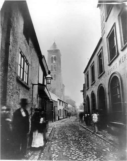 The site chosen was on Chapel Lane, next door to St Mary's Church. St Mary's was Belfast's first Catholic Church since the 17th century. The photo is from the 1890s, where we can see its unique tower (no longer part of the building) /3