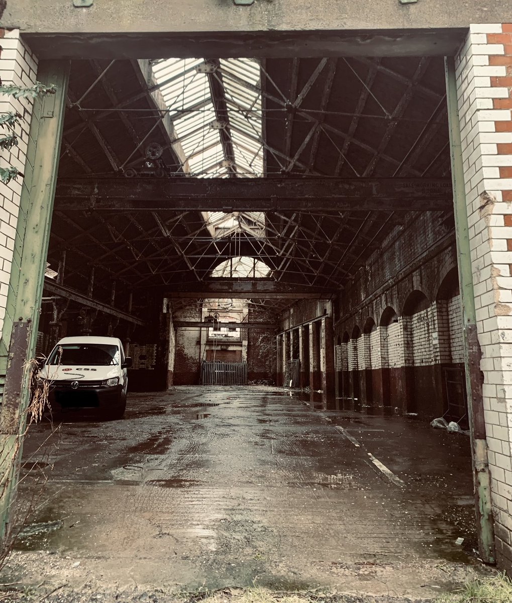 This is the site today (credit  @maevemonaghan): one can still see the original trusses and some of the industrial architecture. Kept behind rolled shutters, it is a rare sight. What will be the future of Belfast's first electric power station? /end