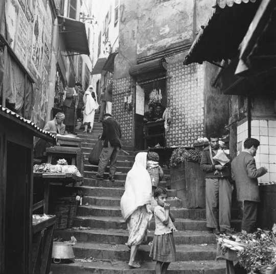 Sem PresserStreet Scene in Algiers, 1959See the marketplace in old AlgiersSend me photographs and souvenirsJust remember when a dream appearsYou belong to meJo Stafford or Patsy Cline? Let's go with Jo this morning: