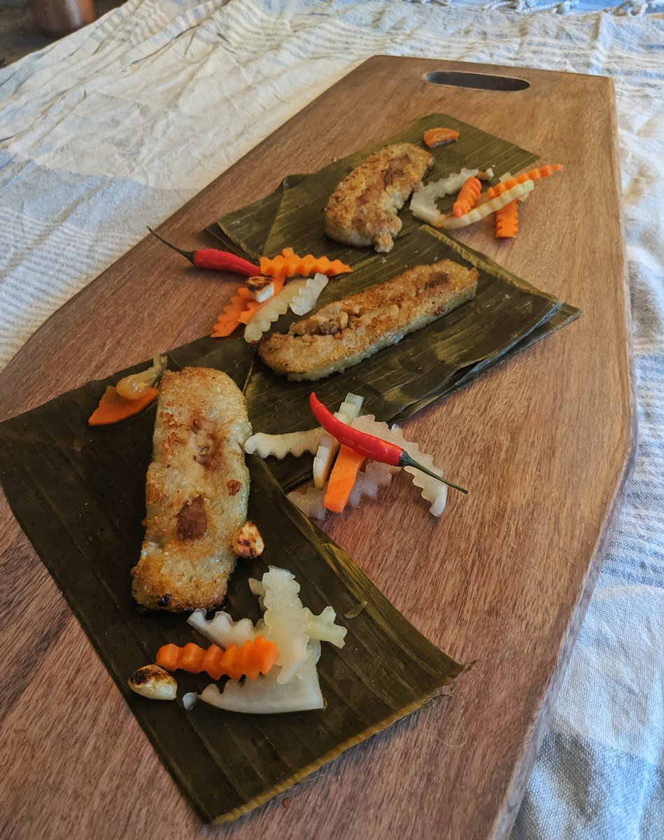 CarolynVan's tweet photo. T'is the season. Bánh Tét in the houuuuse to celebrate Lunar New Year. A traditional (and delicious 🤤) ancestral offering representing the earth.

#BanhTet #EarthCake #ChucMungNamMoi #LunarNewYear #Vietnamese #VietnameseNewYear https://t.co/DDqD7pKkt4