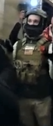Individual involved in the assault of several members of the media and destruction of property at the media staging area at the Northeast Corner of the U.S. Capitol on January 6.