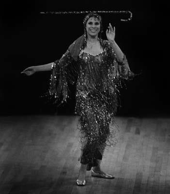 Women performing the dance (raqs el assaya) is more delicate and flirtatious. And the stick used is bit smaller. Their outfits can consist of a feminized galabiya or Assuit clothing, some sort of bedazzling costume with the stick is what’s needed.