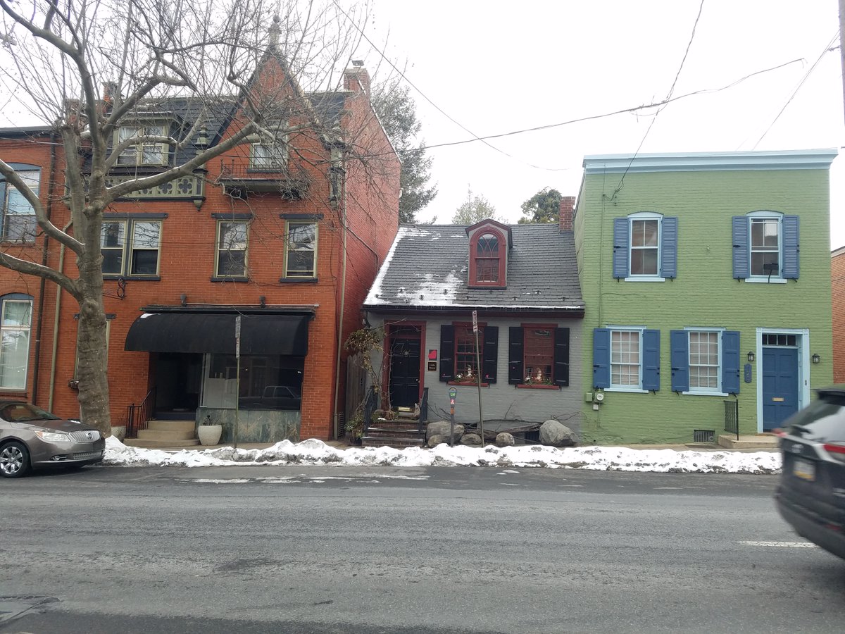 They also have a building that looks similar to the Caulker Houses in Fell's Point (Baltimore). Just like in Fell's Point, this small house is dwarfed by a rowhouse next to it that towers over it. Even though this house hasn't been preserved like the caulkers, it's beautiful.