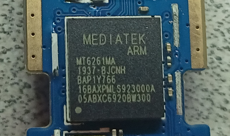 A little bit of hot air, and we're in! And it's a Mediatek ARM chip!