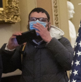 twfisher1's tweet photo. 1/ A new thread, on this guy you can spot lurking in the background on some photos of early invaders to the capitol.  It turns out he is a parler user #RandomWatching who posted some interesting videos there. https://t.co/v1h6PKH8Hn