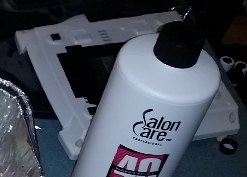 However, I found something else more concerning.I had originally taped off the label on the bottom so the glue wouldn't be damaged while retr0brighting