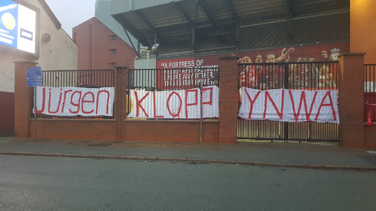 MerPolLFC's tweet image. Hi all. I am aware of a posting doing the rounds on social media regards Jurgen Klopp. I have just driven past Anfield Stadium and can 100% confirm the banner on the Kop railings reads JURGEN KLOPP YNWA and has NEVER read anything different. @LFC @SPIRITOFSHANKLY