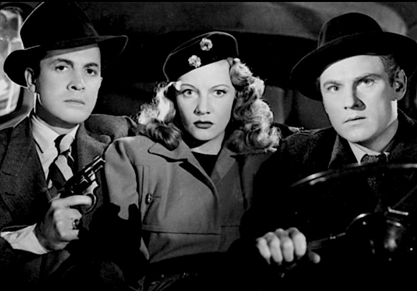 LOVE IS DANGEROUS ~ Does this gun make me look fat?"DECOY" ~ She wants money. Badly. Even if she has to revive a dead man to find out where he buried it. Ann Gillie is killer. No really. To every man who falls for her and crosses her path. #ClassicFilmValentines