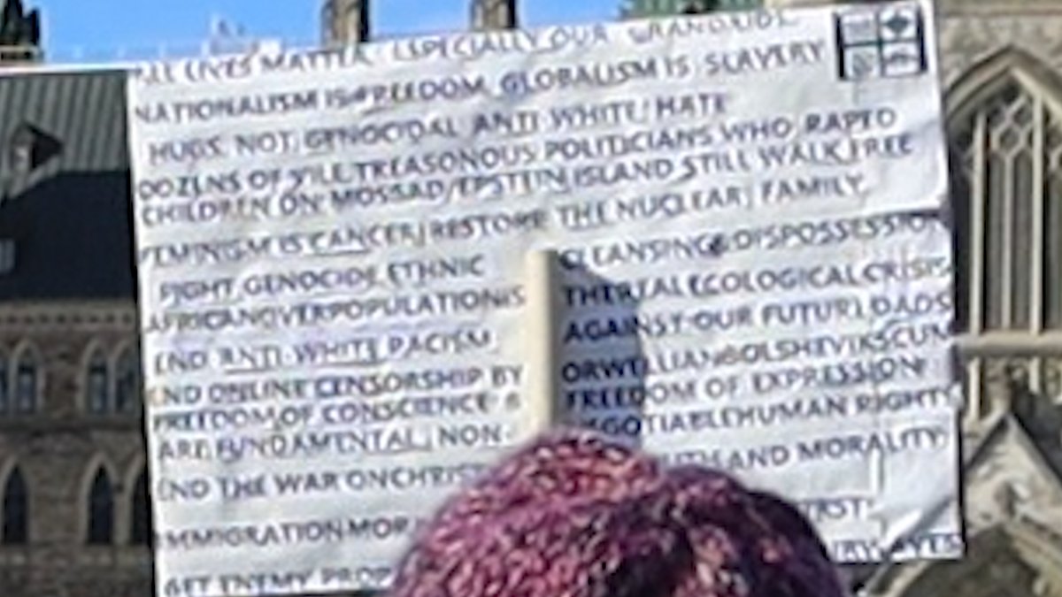 Here's one double-sided sign from the crowd. Apologies that the more racist side is out of focus.FAQ:Q: Is that a Nazi Iron Cross on the top right of that sign about "genocidal anti-white hate"?A: Why yes, yes it is. /14