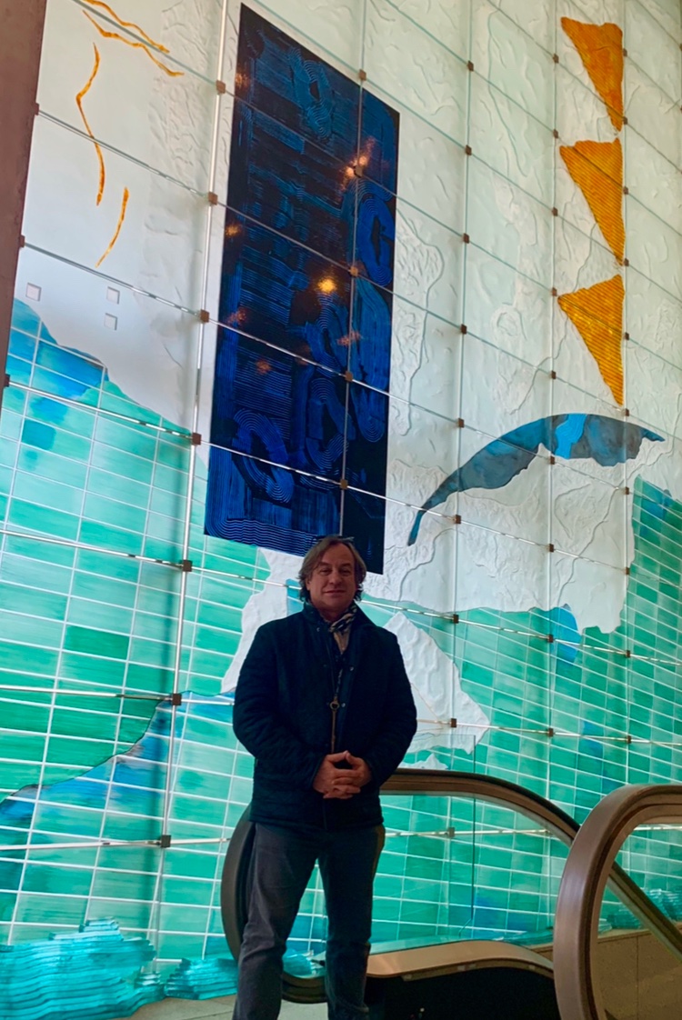 jblabroco's tweet photo. @CanEmbJapan @CdnHeritage I took a picture by the flag at my visit to the embassy! The Inuit collection is very special as well as Waren Carther’s  wall of sculptured glass! Thank you so much for your hospitality during my visit. https://t.co/zOJ9uG0RfG