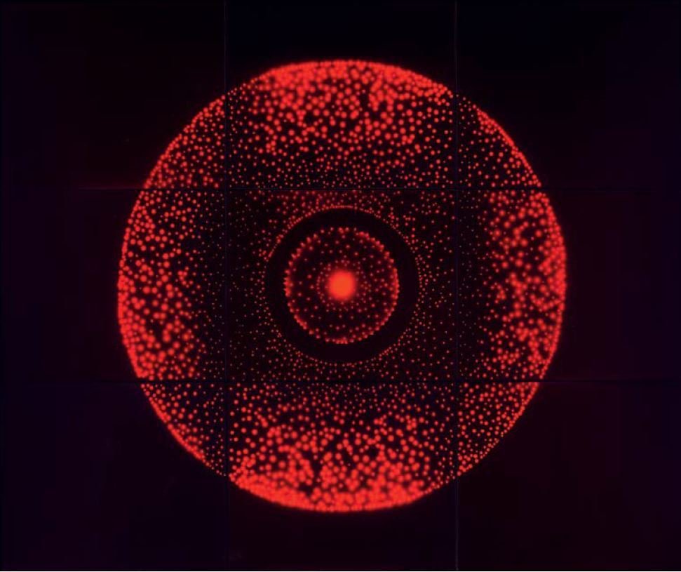 Garry Fabian Miller's (b. 1957) work slowly exposes light through coloured glass, liquid and cut forms onto photographic paper, creating camera-less renderings of geometric forms.