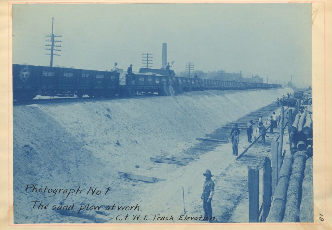 A new innovation that occurred to speed up the process of building the embankments were rail cars w/ pivoting side walls. In the photo below you can see how the sand is starting to escape as it was opened. This allowed the sand to be dumped from an already elevated track.6/