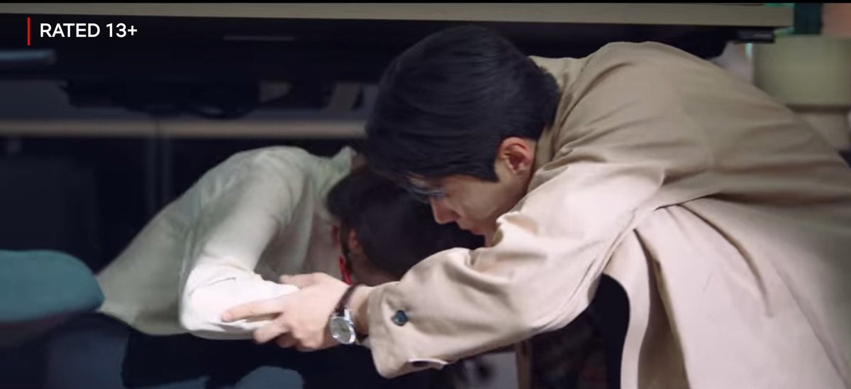 Next: Kim Seonho should be hiding under the desk and doing hush sign with his finger 