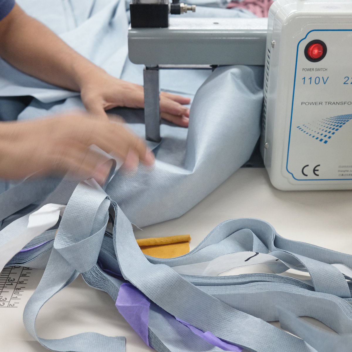 wearegoldatech's tweet photo. PPE made locally. Our manufacturer in New York City putting the final stamp on our medical gowns.

#goldatech #healthwear #PPE https://t.co/nYR7dUYUBf