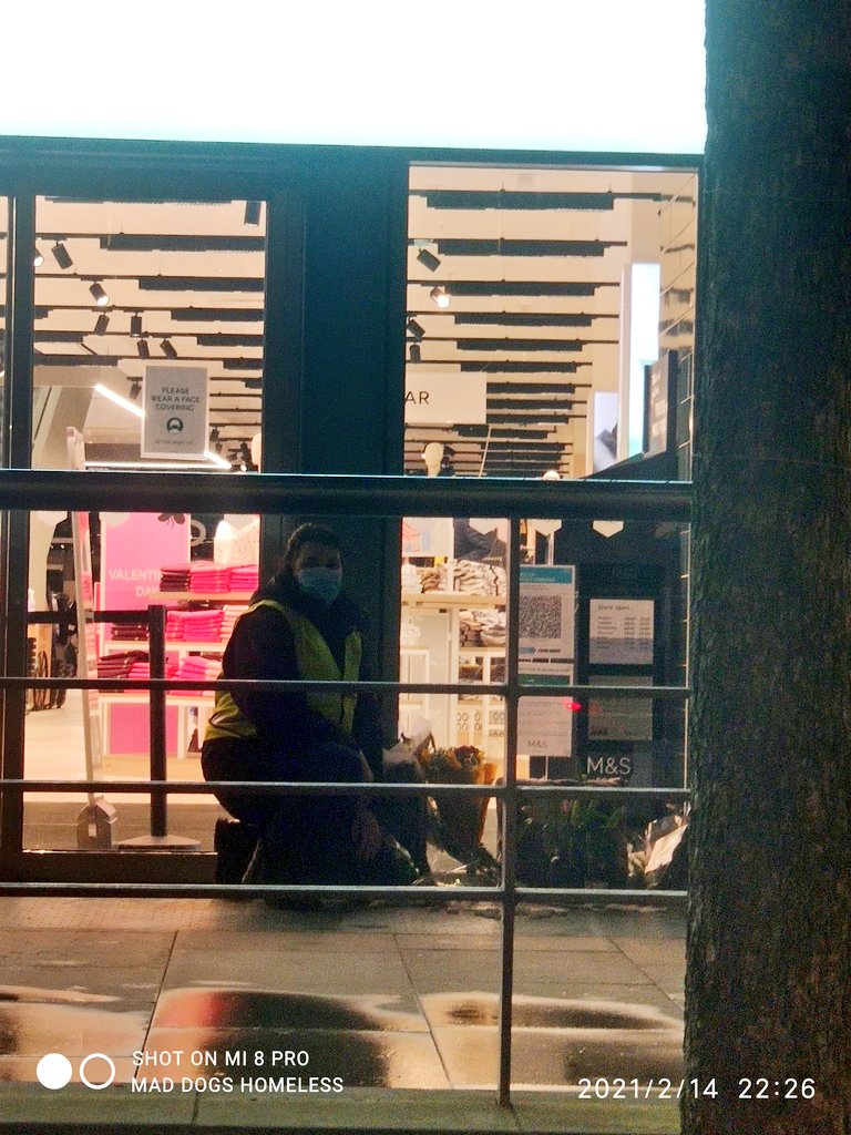 MadDogsHomeless's tweet photo. Here's #TeamMadDogs Sandra,
spending a quiet moment at the flowers and messages left by fellow #GrassRoots orgs and members of the public, at the spot where John Wrench was pronounced dead by #EmergencyServices in #Manchester outside @marksandspencer flagship store.
#RIP John https://t.co/VIv6KDeLKh