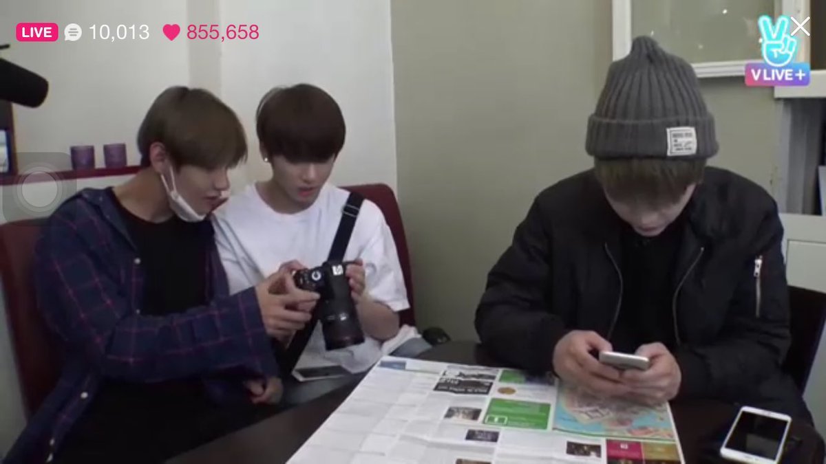 Taekook looking at Yoongi’s picture