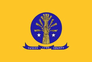 SUSSEX COUNTY: Okay I got creamed by my own 10-minute limit here because I couldn't find a decent wheat image. But if you have a perfectly nice green seal with gold wheat on it that would make a great flag, why make up a new, uglier seal to hurl onto a bedsheet?