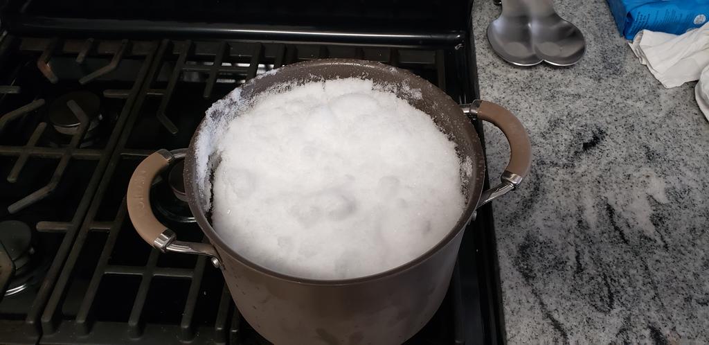 Snow put on stove to boil