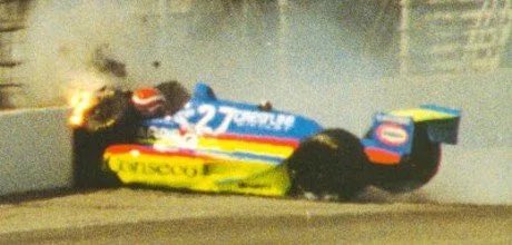 Nelson Piquet, a 3 time F1 champion, had a crash that resulted in severe leg injuries in his first attempt at the Indy 500 in 1992. The car rotated, but this shows the importance of leg protection and keeping the legs behind the front axle. The red and green is his helmet.