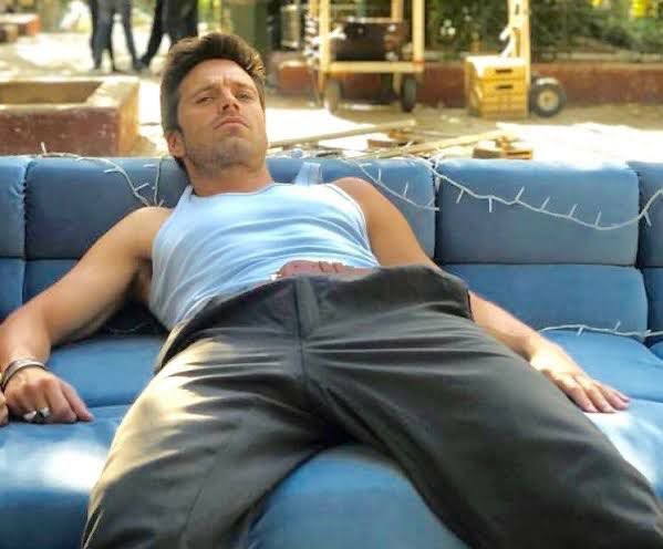 sebastian stan sitting with his legs open, a very needed thread 