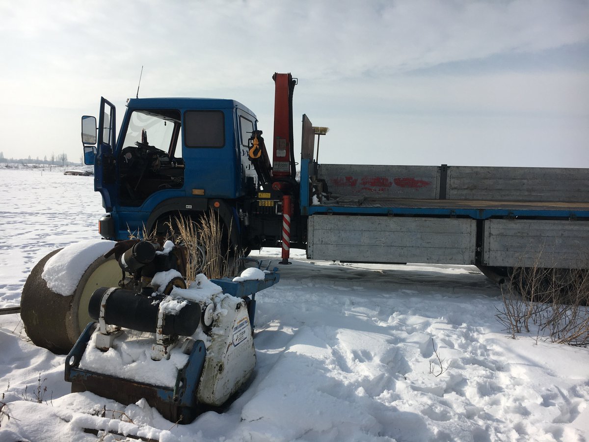 I've wanted for years to get it fixed and so Renča and I organised for a truck to come and collect it today. We had to do it in the snow, so as to not damage the grass and so that we can get it fixed in time to use pre-season. Here it is and getting ready to lift. 2/14