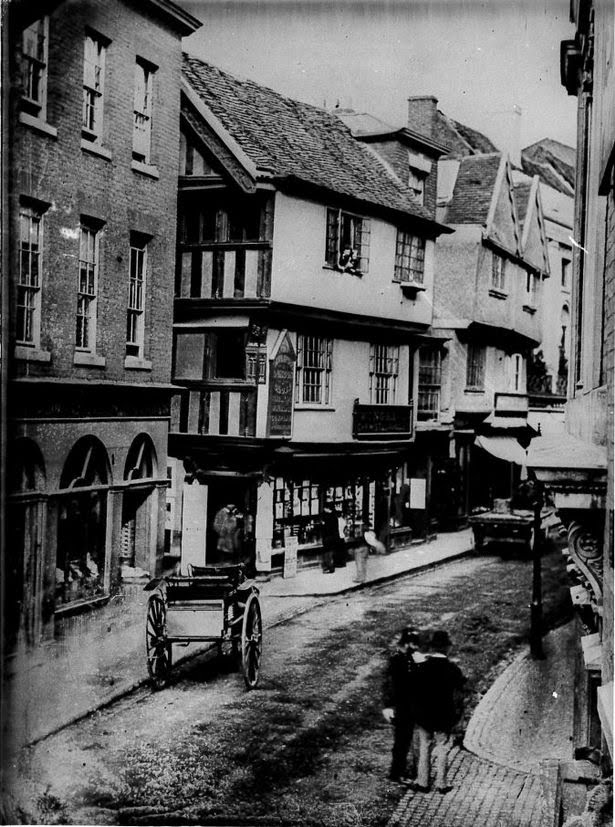 Wyatt Wingrave’s store is the ground floor of the timber framed building now long gone. 
He would have used heavy glass plates which were slotted into a huge camera as film was yet to be invented.
c1860
#OldCoventry 
#WyattWingrave