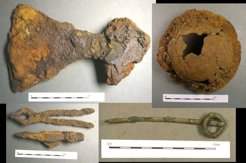 Other grave goods consisted of an axe, a knife, a bronze ring-pin from Ireland, items of pottery, a whetstone from Norway, a drinking horn, a sickle, and a set of tongs and a ladle, which each contained traces of organic materials.