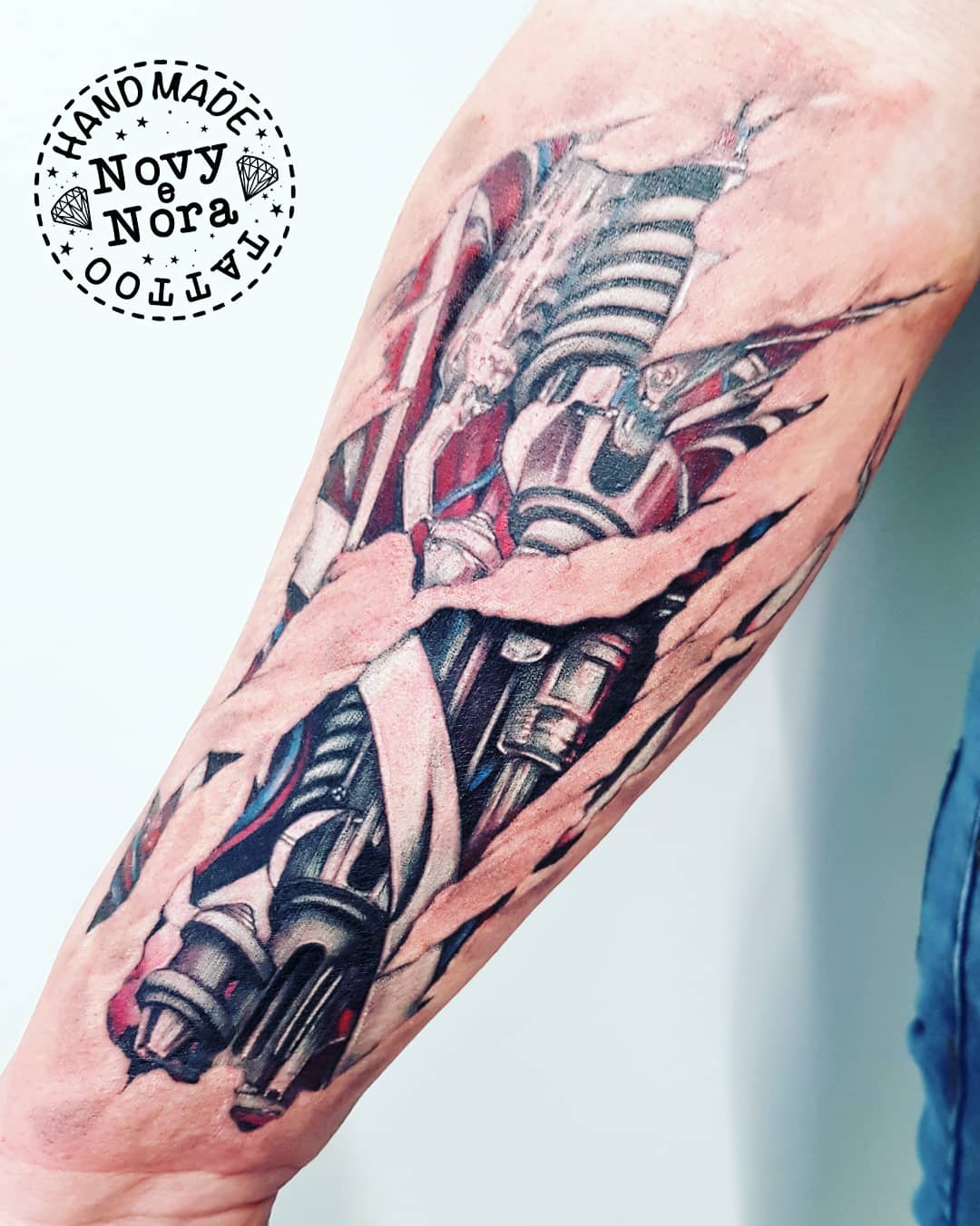 Pistons and wires going down top of arm looking as if mechanical parts are  underneath the skin in the style of terminator or iron man tattoo idea   TattoosAI
