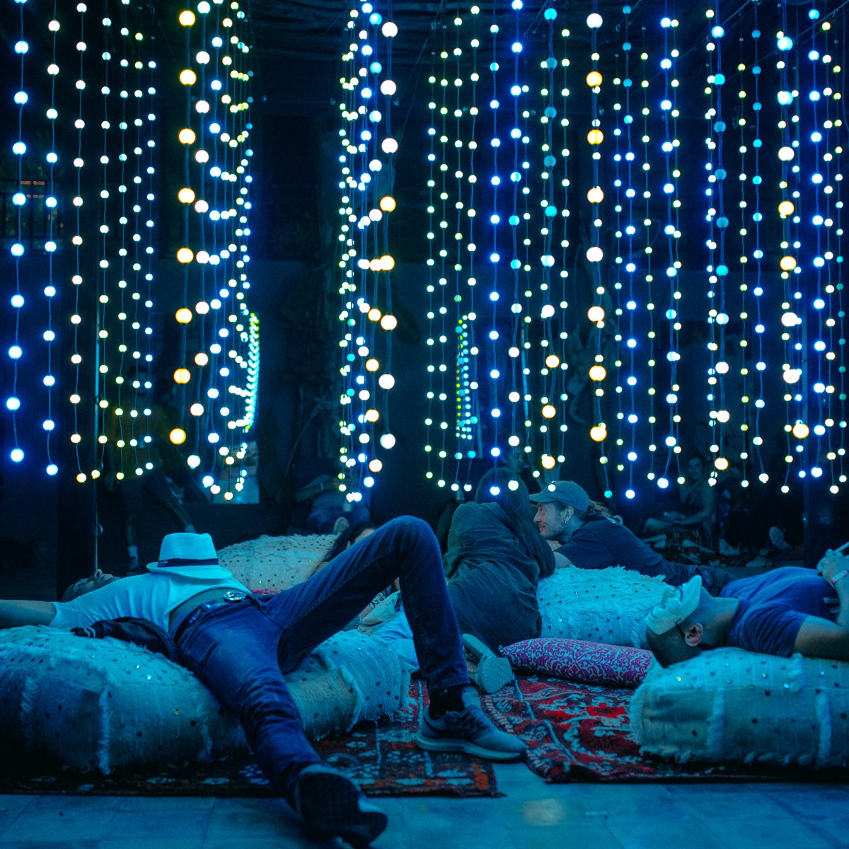 Taking a quiet moment under Squidsoup's light installation at Oasis 2019.