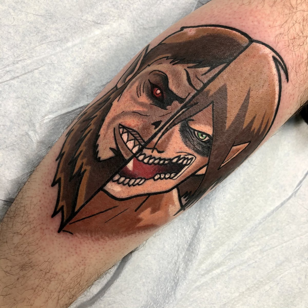 Got this Attack on Titan tattoo while I was on breakpic.twitter.com/m7GO6yH...