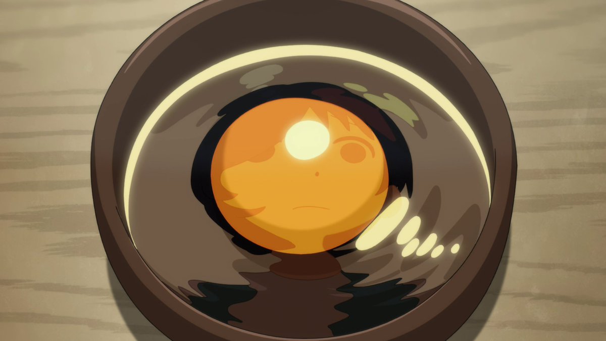 Ai is being reflected in the egg yolk that's in the bowl, so when looking at this shot we have to associate the yolk with how Ai is currently feeling. She's currently vulnerable, outside of her shell, feeling confined as she's having dinner with her mother and Sawaki.