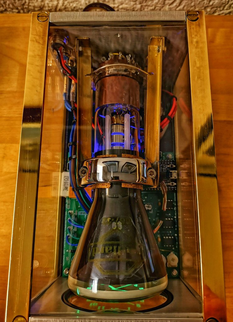 MAVHH's tweet image. Another #ClockDown project.

This one uses a 50's Mullard DG7/32 Cathode Ray Tube, probably destined for an Oscilloscope. I left the electronics to Howard Constantine's OSC7.0 kit (needs assembly!)
Rather high voltages so I made a strong case with 4mm glass, brass and aluminium.