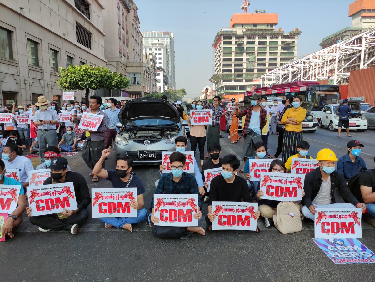Myanmar_Now_Eng's tweet photo. Since military seized power, civil servants have put their lives and livelihoods on the line by joining the growing civil disobedience movement (CDM).

"Don't go to office. Break away!" is the motto of CDM. Protesters descending on a road in downtown Yangon on Wednesday morning. https://t.co/htGbhJPtXH
