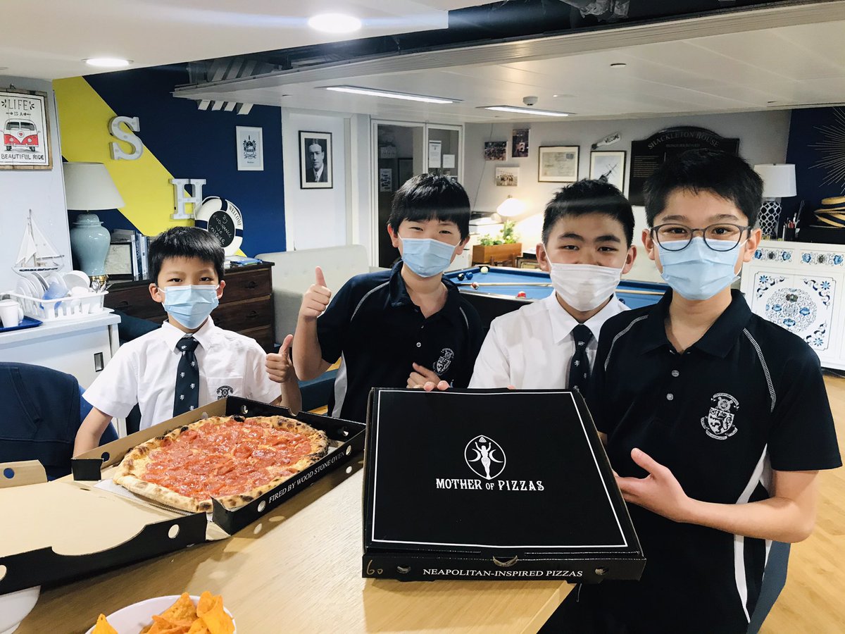 HHKSShackleton's tweet photo. Pizza Party and ice cream! Well done to Team Wild who celebrated in style as Duty Team champions, setting a tremendous example to the other #boysofshackleton boarders! @Harrow_HK @HeadHarrowHK #boysofhonour https://t.co/MjFeZclRFd